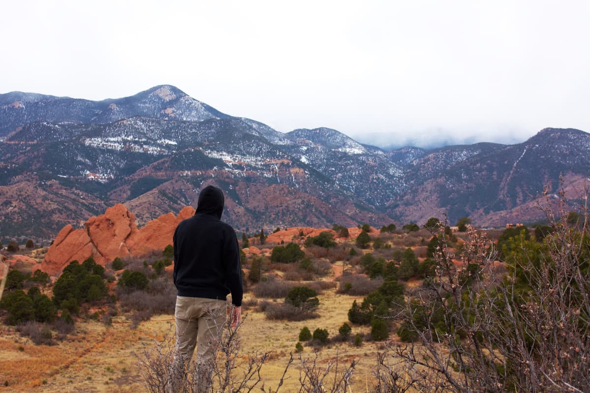 A photo of Zach Vivian at the Garden of the Gods overlooking Pike's Peak in Colorado Springs, Colorado